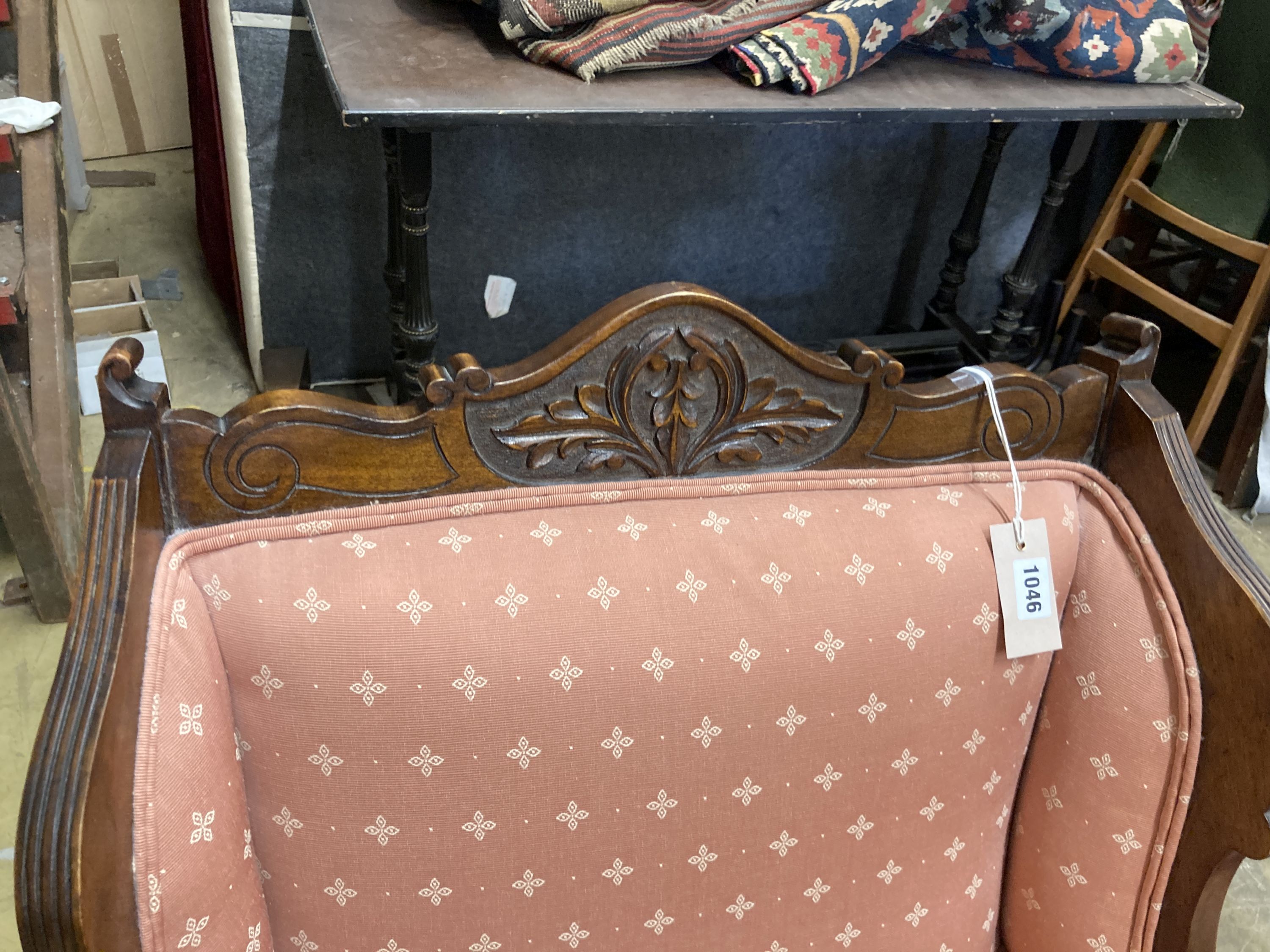 A late Victorian mahogany armchair together with a matching tub framed elbow chair